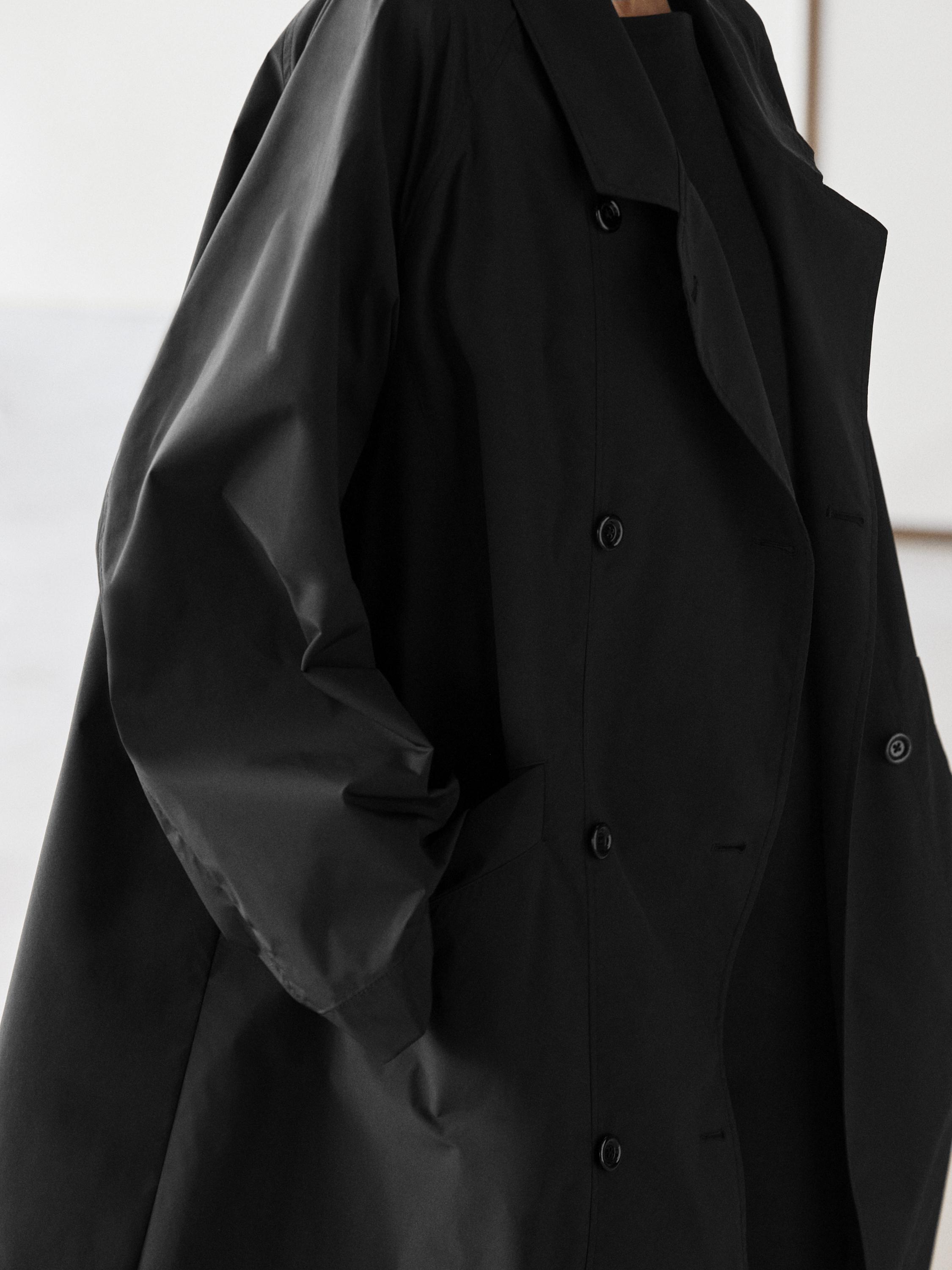 Double-breasted technical trench coat
